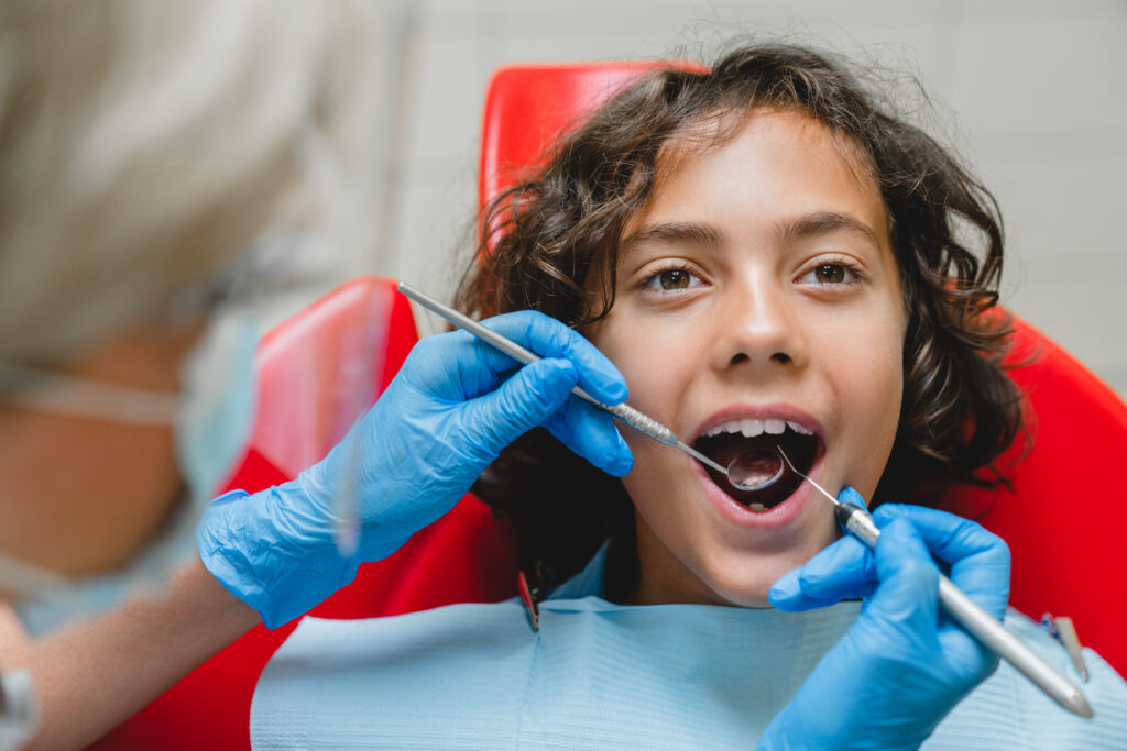 Lakeside smile Children stomatology concept. Caucasian preteen boy visiting dentist.