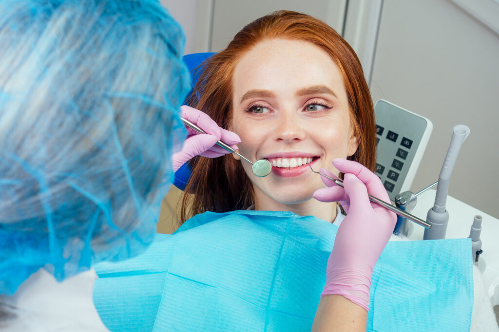 Lakeside smile Dental drilling procedure and check up on beautiful teeth and open mouth.