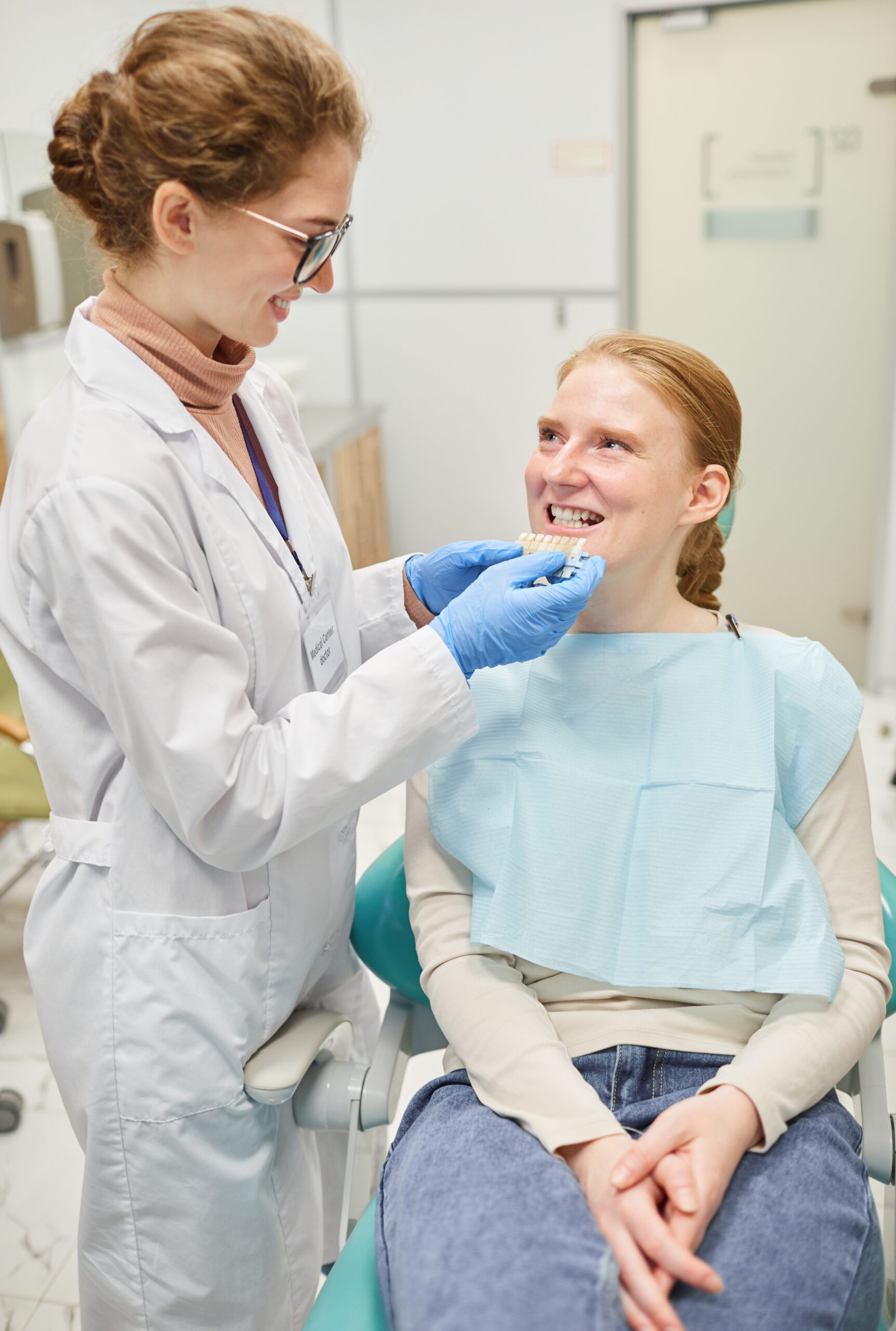 Lakeside smile Dentist working with patient they choosing implants for new teeth